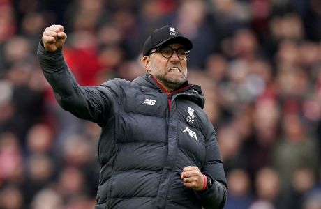 FILE - Liverpool's manager Jurgen Klopp celebrates at the end of the English Premier League soccer match between Liverpool and Bournemouth at Anfield stadium in Liverpool, England, March 7, 2020. Jurgen Klopp announced Friday Jan. 26, 2024, he will step down as Liverpool manager at end of this season. (AP Photo/Jon Super, File)