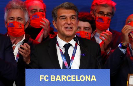 FILE - Joan Laporta celebrates his victory after elections at the Camp Nou stadium in Barcelona, Spain, March 7, 2021. Spain was the only European Union member to refuse to sign a joint statement on sports released by France on Thursday, Feb. 8, 2024 because the government in Madrid saw it as a premature attack on the Super League. (AP Photo/Joan Monfort, File)
