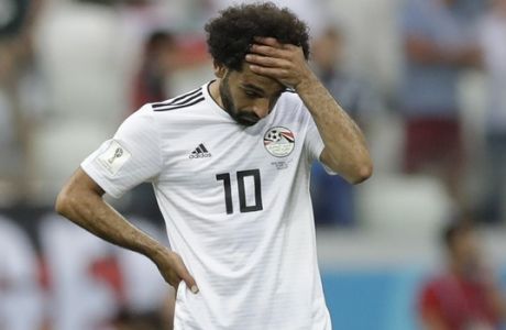 Egypt's Mohamed Salah reacts after Saudi Arabia's Salem Aldawsari scored his side' second goal during the group A match between Saudi Arabia and Egypt at the 2018 soccer World Cup at the Volgograd Arena in Volgograd, Russia, Monday, June 25, 2018. (AP Photo/Andrew Medichini)