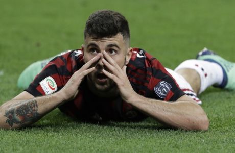 AC Milan's Patrick Cutrone gestures after missing a scoring chance during a Serie A soccer match between AC Milan and Benevento, at the San Siro stadium in Milan, Italy, Saturday, April 21, 2018. (AP Photo/Luca Bruno)