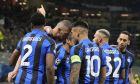 Inter Milan's Edin Dzeko, second left, celebrates with his teammates after scoring his side's opening goal during the Champions League semifinal first leg soccer match between AC Milan and Inter Milan at the San Siro stadium in Milan, Italy, Wednesday, May 10, 2023. (AP Photo/Antonio Calanni)