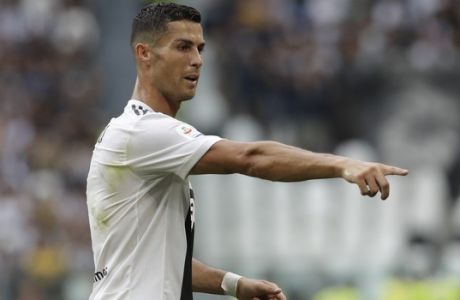 Juventus' Cristiano Ronaldo gestures to his teammates during the Serie A soccer match between Juventus and Lazio at the Allianz Stadium in Turin, Italy, Saturday, Aug. 25, 2018. (AP Photo/Luca Bruno)