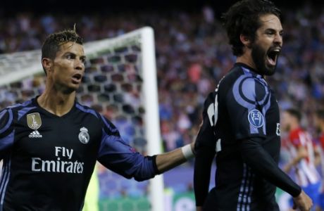 Real Madrid's Isco, right, celebrates with Cristiano Ronaldo after scoring a goal during the Champions League semifinal second leg soccer match between Atletico Madrid and Real Madrid at the Vicente Calderon stadium in Madrid, Wednesday, May 10, 2017. (AP Photo/Francisco Seco)