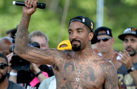 Jun 22, 2016; Cleveland, OH, USA; Cleveland Cavaliers guard J.R. Smith (5) greets the crowd during the Cleveland Cavaliers NBA championship celebration in downtown Cleveland. Mandatory Credit: Ken Blaze-USA TODAY Sports   ORG XMIT: USATSI-271480 ORIG FILE ID:  20160622_gav_bk4_228.jpg