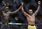 Nigeria's Israel Adesanya, left, reacts after defeating Brazil's Anderson Silva during their middleweight bout at the UFC 234 event in Melbourne, Australia, Sunday, Feb. 10, 2019. (AP Photo/Andy Brownbill)