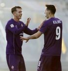 Fiorentina's Nikola Kalinic, right, celebrates with teammate Federico Bernardeschi after scoring during a Serie A soccer match between Fiorentina and Chievo at the Artemio Franchi stadium in Florence, Italy, Sunday, Dec. 20, 2015. (AP Photo/Fabrizio Giovannozzi) 