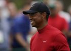 Tiger Woods smiles as he walks off the seventh tee during the final round for the Masters golf tournament, Sunday, April 14, 2019, in Augusta, Ga. (AP Photo/David J. Phillip)