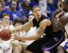 **FILE** IN this March 1, 2008 file photo, Kansas State forward Michael Beasley, left, works against Kansas guard Rodrick Stewart during the first half of their college basketball game in Lawrence, Kan.  The Chicago Bulls won the NBA's draft lottery Tuesday, May 20, 2008, giving them the right to choose between star freshmen Michael Beasley and Derrick Rose.(AP Photo/Orlin Wagner, File)