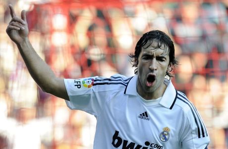 Real Madrid's Raul Gonzalez celebrates after scoring against Sporting Gijon during their Spanish La Liga soccer match at El Molinon stadium in Gijon, northern Spain, on Sunday, Feb.15,  2009. Raul Gonzalez broke Real Madrid's all-time scoring record on Sunday, surpassing the previous mark of 307 goals in official competitions held by Alfredo di Stefano. (AP Photo/Alvaro Barrientos)