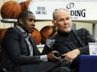Denver Nuggets Executive Vice President of Basketball Operations Masai Ujiri, left, talks with head coach George Karl during the first day of NBA basketball training camp in Denver, Friday, Dec. 9, 2011. (AP Photo/Jack Dempsey)