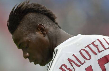 FILE - In this Sunday, March 6, 2016 file photo, AC Milan's Mario Balotelli looks down during a Serie A soccer match against Sassuolo, at Reggio Emilia's Mapei stadium, Italy. Liverpool has offloaded Mario Balotelli to French club Nice, two years after signing the troubled striker. The 26-year-old Italian managed only four goals in 28 appearances for Liverpool and spent last season on loan at AC Milan. Nice president Jean-Pierre Rivere said on Wednesday, Aug. 31, 2016 "we hope that Nice, in a family atmosphere, he will find the pleasure of the game." (AP Photo/Marco Vasini, file)