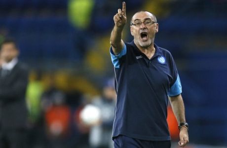 FILE - In this Wednesday, Sept. 13, 2017 file photo, Napoli's head coach Maurizio Sarri shouts instructions to his players during the Group F Champions League soccer match between Shakhtar Donetsk and Napoli at the Metalist Stadium in Kharkiv, Ukraine. Napoli's president has thanked coach Maurizio Sarri for his contributions after the Serie A club reportedly reached a deal to hire Carlo Ancelotti as his replacement. Napoli have not announced Sarri's departure, but a messaged posted on Twitter by president Aurelio De Laurentiis on Wednesday, May 23, 2018 and retweeted by the club's official account, seemed to confirm he is leaving. (AP Photo/Efrem Lukatsky, File )
