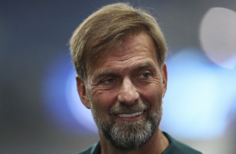 Liverpool's manager Jurgen Klopp smiles before the Champions League Group A soccer match between Rangers and Liverpool at Ibrox stadium in Glasgow, Scotland, Wednesday, Oct. 12, 2022. (AP Photo/Scott Heppell)