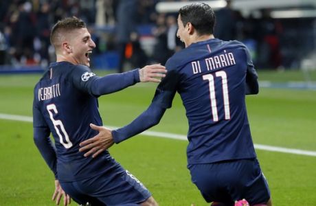 PSG's Angel Di Maria, right, celebrates with teammate Marco Verratti after scoring the first goal of the game during the Champion's League round of 16, first leg soccer match between Paris Saint Germain and Barcelona at the Parc des Princes stadium in Paris, Tuesday, Feb. 14, 2017. (AP Photo/Francois Mori)