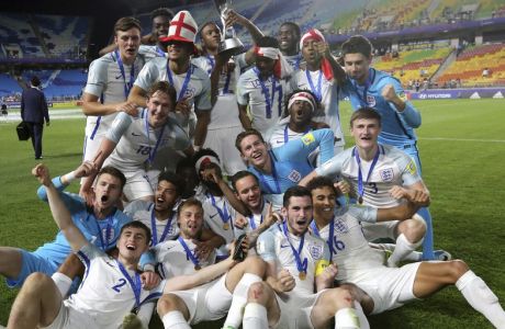 England players celebrate after defeating Venezuela 1-0 to win the final of the FIFA U-20 World Cup Korea 2017 at Suwon World Cup Stadium in Suwon, South Korea, Sunday, June 11, 2017. (AP Photo/Ahn Young-joon)