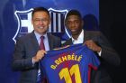 Barcelona's new signing player Ousmane Dembele, right, and FC Barcelona's president Josep Maria Bartomeu pose for the media during official presentation at the Camp Nou stadium in Barcelona, Spain, Monday, Aug. 28, 2017.  Barcelona is shoring up its attack following Neymar's departure by buying Ousmane Dembele from Borussia Dortmund in a deal that could reach 147 million euros (about $173 million). (AP Photo/Manu Fernandez)