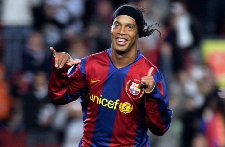 FILE - In this Dec. 9, 2007 file photo, FC Barcelona player Ronaldinho, from Brazil, celebrates his goal against Deportivo Coruna during his Spanish league soccer match at the Camp Nou Stadium in Barcelona, Spain. Barcelona says former player Ronaldinho will be named its new ambassador, representing the club at various institutional events and helping globalize the Barca brand and its values. The club said the deal with the Brazilian playmaker will be signed Friday, Feb. 3, 2017 at Camp Nou. (AP Photo/Manu Fernandez, File)