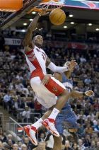 Toronto Raptors guard Sonny Weems (24) dunks against Charlotte Bobcats forward Boris Diaw (32) during the first half of an NBA basketball game in Toronto on Wednesday, Nov. 10, 2010. (AP Photo/The Canadian Press, Frank Gunn)