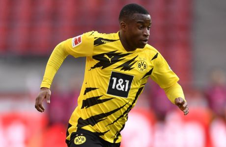 Dortmund's Youssoufa Moukoko in action during the German Bundesliga soccer match between Cologne and Dortmund at the RheinEnergieStadion stadium in Cologne, Germany, Saturday, March 20, 2021. (Marius Becker/Pool via AP)