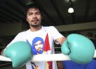 FILE - This Sept. 20, 2010, file photo shows Filipino boxing champion Manny Pacquiao taking a break in a training session at the Elorde Gym in Manila, Philippines.  The pound-for-pound king has been preparing for his upcoming fight Nov. 20 against Antonio Margarito in his native Philippines, where Typhoon Megi recently struck. (AP Photo/Bullit Marquez, File)