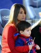 Lionel Messi's girlfriend Antonella Roccuzzo holds their son Thiago Messi, prior to the Spanish La Liga soccer match between FC Barcelona and Rayo Vallecano at the Camp Nou stadium in Barcelona, Spain, Sunday, March 8, 2015. (AP Photo/Manu Fernandez)