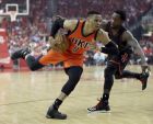 Oklahoma City Thunder's Russell Westbrook (0) drives toward the basket as Houston Rockets' Patrick Beverley defends during the first half in Game 1 of an NBA basketball first-round playoff series, Sunday, April 16, 2017, in Houston. (AP Photo/David J. Phillip)