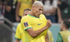 Brazil's Richarlison celebrates after scoring during the World Cup group G soccer match between Brazil and Serbia, at the Lusail Stadium in Lusail, Qatar, Thursday, Nov. 24, 2022. (AP Photo/Aijaz Rahi)