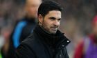 Arsenal's manager Mikel Arteta reacts just before the start of the English Premier League soccer match between Arsenal and Fulham at Craven Cottage stadium in London, Sunday, Dec. 31, 2023. (AP Photo/Alastair Grant)