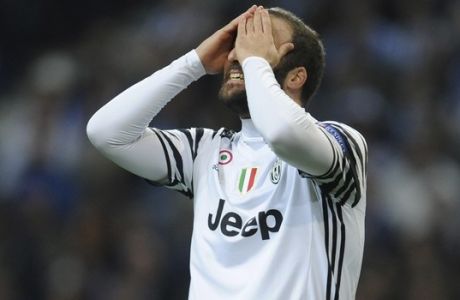 Juventus' Gonzalo Higuain reacts after a missed chance to score during the Champions League round of 16, first leg, soccer match between FC Porto and Juventus at the Dragao stadium in Porto, Portugal, Wednesday, Feb. 22, 2017. (AP Photo/Paulo Duarte)