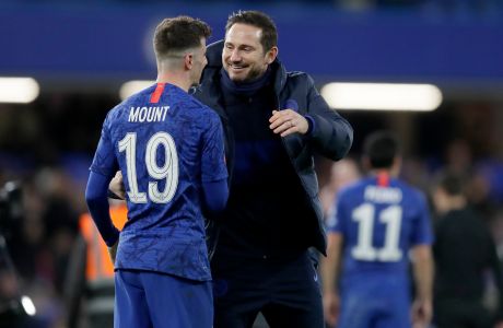Chelsea's head coach Frank Lampard, right, embraces Mason Mount following their 2-0 win in the English FA Cup fifth round soccer match between Chelsea and Liverpool at Stamford Bridge stadium in London Wednesday, March 4, 2020. (AP Photo/Kirsty Wigglesworth)