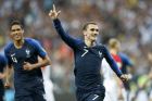 France's Antoine Griezmann celebrates after scoring on a penalty his side' second goal during the final match between France and Croatia at the 2018 soccer World Cup in the Luzhniki Stadium in Moscow, Russia, Sunday, July 15, 2018. (AP Photo/Matthias Schrader)