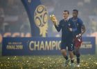 France's Antoine Griezmann holds the World Cup trophy as he jogs around the pitch after France defeated Croatia in the final match between France and Croatia at the 2018 soccer World Cup in the Luzhniki Stadium in Moscow, Russia, Sunday, July 15, 2018. France won the game 4-2. (AP Photo/Francisco Seco)