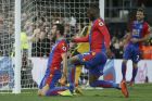 Crystal Palace's Luka Milivojevic, left, celebrates, with Crystal Palace's Christian Benteke, after scoring a penalty during the English Premier League soccer match between Crystal Palace and Arsenal at Selhurst Park in London, Monday April 10, 2017. (AP Photo/Tim Ireland)