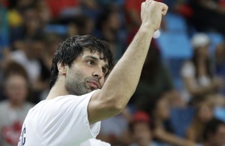 Serbia's Milos Teodosic celebrates on the bench at the end of a semifinal round basketball game against Australia at the 2016 Summer Olympics in Rio de Janeiro, Brazil, Friday, Aug. 19, 2016. (AP Photo/Charlie Neibergall)
