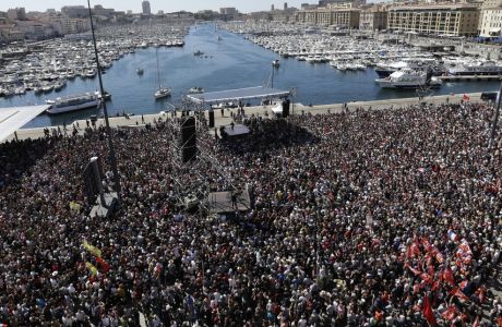 Supporters of French hard-left presidential candidate, Jean-Luc Melenchon, are gathered in Marseille's Old Port, southern France, to attend a campaign rally, Sunday, April 9, 2017. The two-round presidential election is set for April 23 and May 7. (AP Photo/Claude Paris)