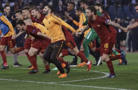 Roma players celebrate reaching the semifinals after the Champions League quarterfinal second leg soccer match between between Roma and FC Barcelona, at Rome's Olympic Stadium, Tuesday, April 10, 2018. (AP Photo/Gregorio Borgia)