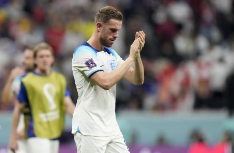 England's Jordan Henderson applauds the fans at the end of the World Cup group B soccer match between England and The United States, at the Al Bayt Stadium in Al Khor , Qatar, Friday, Nov. 25, 2022. The game ended in a goalless draw. (AP Photo/Luca Bruno)