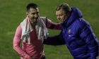 Barcelona's Lionel Messi, left, and Barcelona's head coach Ronald Koeman celebrate after winning a Spanish Copa del Rey round of 16 soccer match against Rayo Vallecano at the Vallecas stadium in Madrid, Spain, Wednesday, Jan. 27, 2021. (AP Photo/Manu Fernandez)