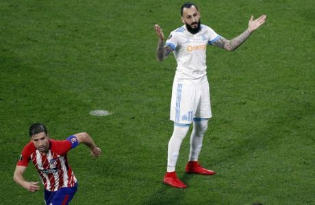 Marseille's Konstantinos Mitroglou reacts after missing a chance to score during the Europa League Final soccer match between Marseille and Atletico Madrid at the Stade de Lyon outside Lyon, France, Wednesday, May 16, 2018. (AP Photo/Christophe Ena)