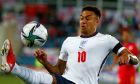 England's Jesse Lingard goes for the ball during the World Cup 2022 group I qualifying soccer match between Andorra and England at the National Stadium in Andorra la Vella, Saturday, Oct. 9, 2021. Manchester United manager Ralf Rangnick says Mason Greenwoods suspension played a role in the clubs decision to keep Jesse Lingard until the end of the season. Greenwood was arrested on Sunday and questioned on suspicion of the rape and assault of a woman. He was released on bail on Wednesday and United has said the 20-year-old forward will not train with, or play for, the club until further notice. (AP Photo/Joan Monfort)