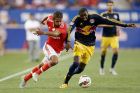 IMAGE DISTRIBUTED FOR INTERNATIONAL CHAMPIONS CUP - Benfica player Mehdi Carcela-Gonzalez (39-L) battles for the ball with New York Red Bulls player Anthony Wallace  at the International Champions Cup, on Sunday, July 26, 2015 in Harrison, New Jersey. (Damian Strohmeyer/AP Images for International Champions Cup)
