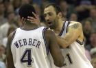 Sacramento Kings' Vlade Divac talks to teammate Chris Webber (4) after Webber fouled out in the fourth quarter against the Dallas Mavericks during game one of the Western Conference semifinal playoff series in Sacramento, Calif., Saturday, May 4, 2002. The Kings beat the Mavericks, 108-91. (AP Photo/Ben Margot)
