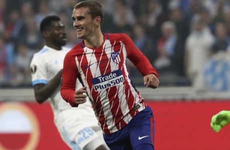 Atletico's Antoine Griezmann celebrates after scoring his side opening goal during the Europa League Final soccer match between Marseille and Atletico Madrid at the Stade de Lyon in Decines, outside Lyon, France, Wednesday, May 16, 2018. (AP Photo/Thibault Camus)
