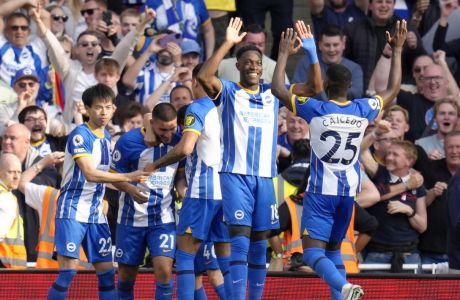 Brighton's Deniz Undav, second from left, celebrates with his teammates after scoring his side's second goal during the English Premier League soccer match between Arsenal and Brighton and Hove Albion at Emirates stadium in London, Sunday, May 14, 2023. (AP Photo/Kirsty Wigglesworth)