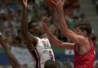 USA's David Robinson goes up to block Croatia's Toni Kukoc during the gold medal basketball game at the Summer Olympics in Barcelona Aug. 8, 1992. Earvin "Magic" Johnson is in foreground. (AP photo/Susan Ragan)