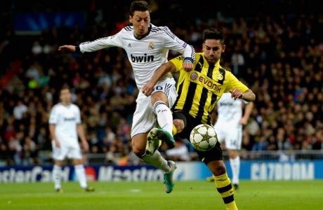 MADRID, SPAIN - NOVEMBER 06:  Mesut Oezil of Madrid and Ilkay Guendogan of Dortmund battle for the ball during the UEFA Champions League Group D match between Real Madrid and Borussia Dortmund at Estadio Santiago Bernabeu on November 6, 2012 in Madrid, Spain.  (Photo by Dennis Grombkowski/Bongarts/Getty Images)