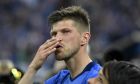 FILE - In this May 13, 2017 file photo, Schalke's forward Klaas Jan Huntelaar gives a kiss to his fans after his last home match between FC Schalke 04 and Hamburger SV in Gelsenkirchen, Germany. Schalke said the 37-year-old Huntelaar, who scored 126 goals in 240 competitive games in his previous stint at the German club between 2010-17, signed a deal to the end of the season. Schalke is hoping Huntelaar can help it avoid relegation.  (AP Photo/Martin Meissner, File)