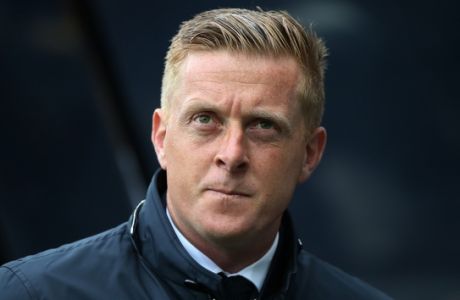 FILE - This is a Saturday, April 25, 2015 file photo of Swansea City's manager Garry Monk as he awaits for the start of their English Premier League soccer match between Newcastle United and Swansea City at St James' Park, Newcastle, England. Swansea  fired manager Garry Monk Wednesday Dec. 9, 2015, after nearly two years in charge, following a dip in form that has seen the team win just one of its last 11 Premier League games. (AP Photo/Scott Heppell, File)