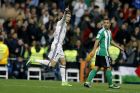 Real Madrid's Cristiano Ronaldo, left, celebrates after scoring his side's first goal against Real Betis during a Spanish La Liga soccer match between Real Madrid and Real Betis at the Santiago Bernabeu stadium in Madrid, Sunday, March 12, 2017. (AP Photo/Francisco Seco)