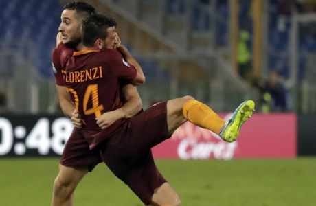 Romas Kostas Manolas, left, celebrates with teammate Alessandro Florenzi after scoring, during a Serie A soccer match between Roma and Inter Milan, at Rome's Olympic Stadium, Sunday, Oct. 2, 2016. (AP Photo/Andrew Medichini)